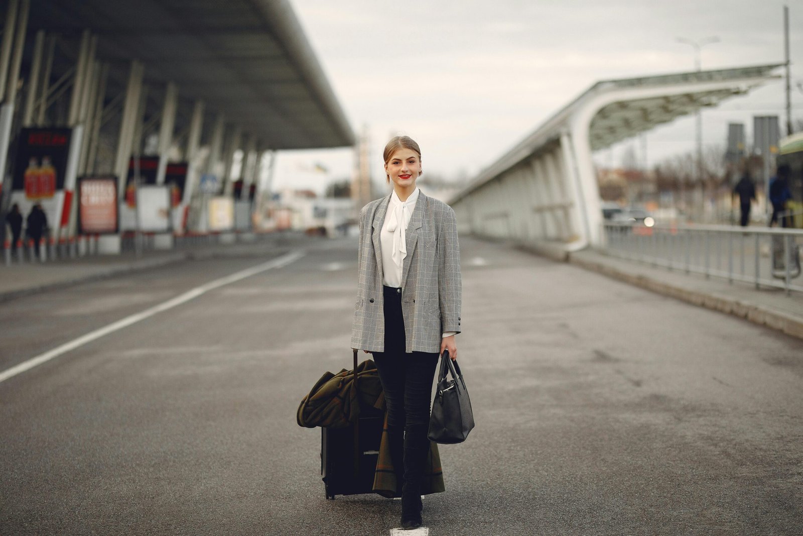 A smiling Licensed Practical Nurse (LPN) standing confidently against a blurred city backdrop, symbolizing the professional growth, adventure, and financial benefits of LPN travel contracts and healthcare careers.