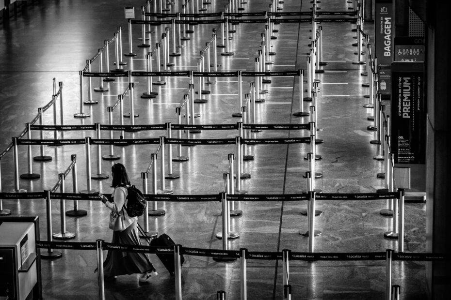 A traveler effortlessly navigating a modern airport with a versatile roller backpack, highlighting the convenience of wheeled luggage for smart and flexible journeys.