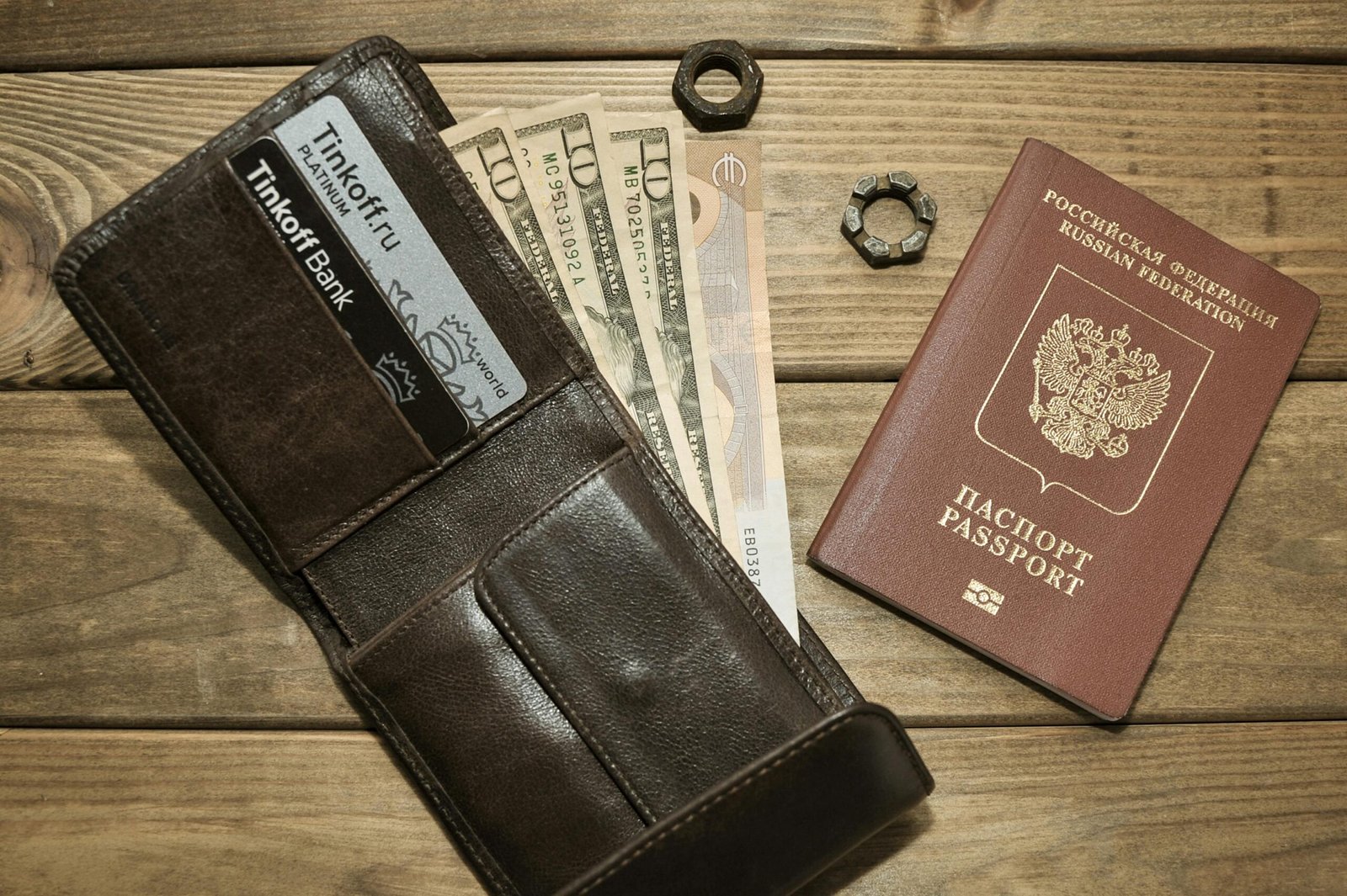Modern travel wallet organized with passport, credit cards, and cash, highlighting secure document management for international travel.