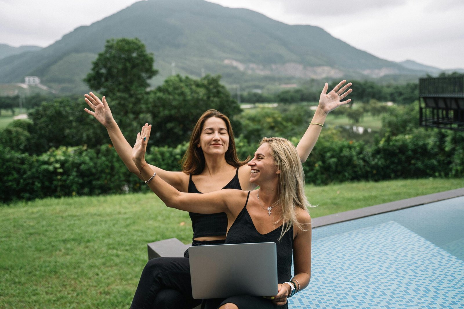 Modern travel advisor enthusiastically planning a trip on a laptop, symbolizing the empowerment and ease of the Fora Travel host agency platform.