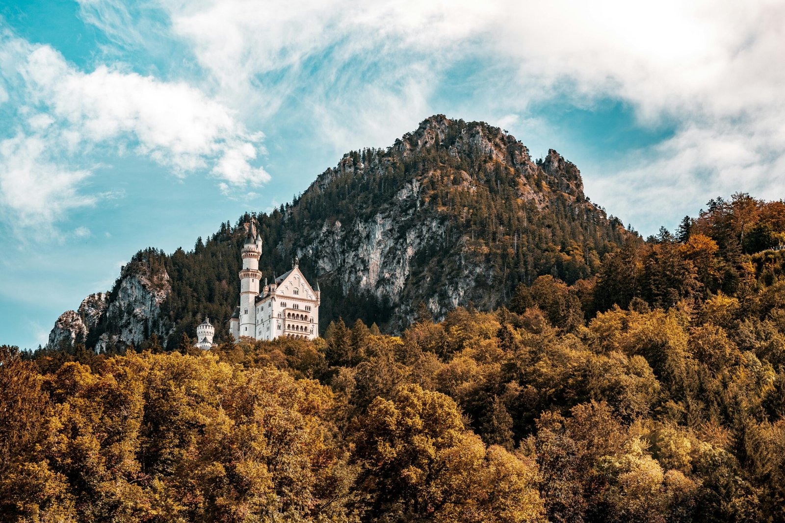 Neuschwanstein Castle in the Bavarian Alps, a fairytale landmark symbolizing Germany's rich history, cultural magic, and breathtaking natural beauty for travel and tourism.