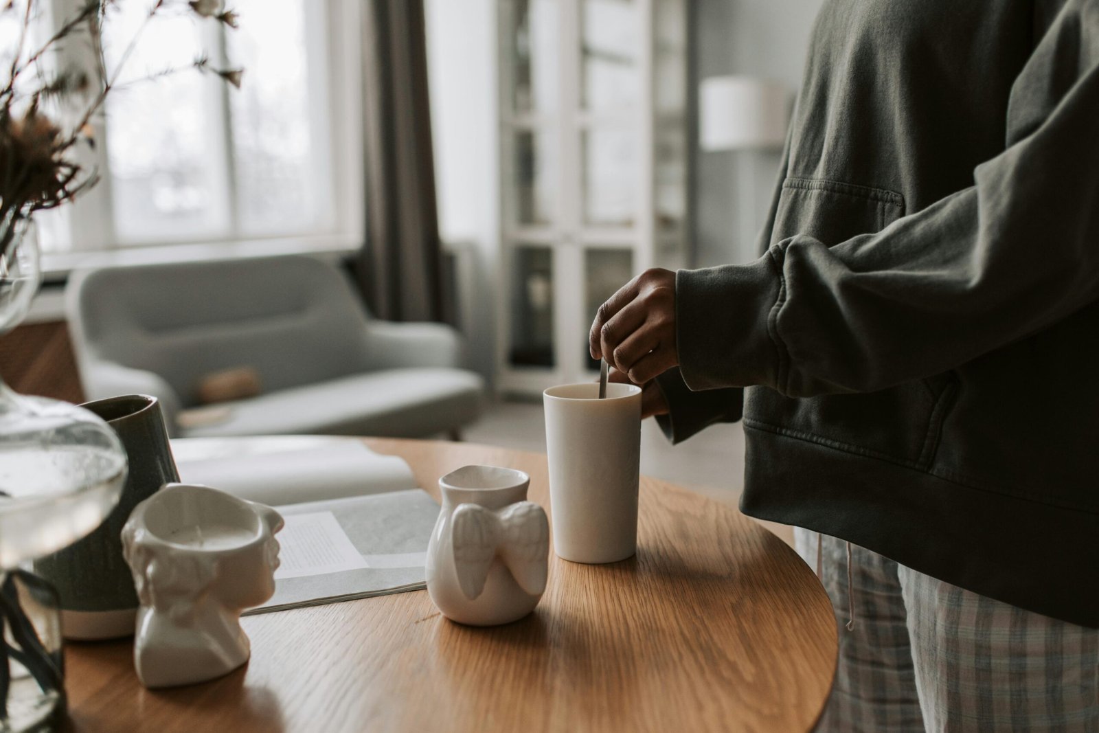 Stylish ceramic travel coffee mug held by a person on their commute, emphasizing pure, untainted coffee flavor and a premium on-the-go experience.