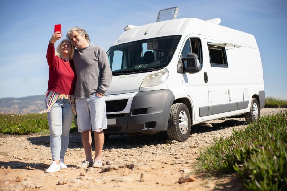Happy family enjoying a scenic camping adventure with a modern travel trailer, symbolizing the freedom and comfort of a home on wheels purchased from Berryland travel trailers dealership.