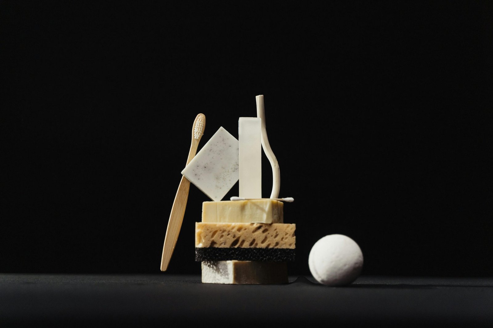 Compact travel toothbrush in a protective case shown with other travel essentials, highlighting portable oral hygiene for smart and healthy travel.