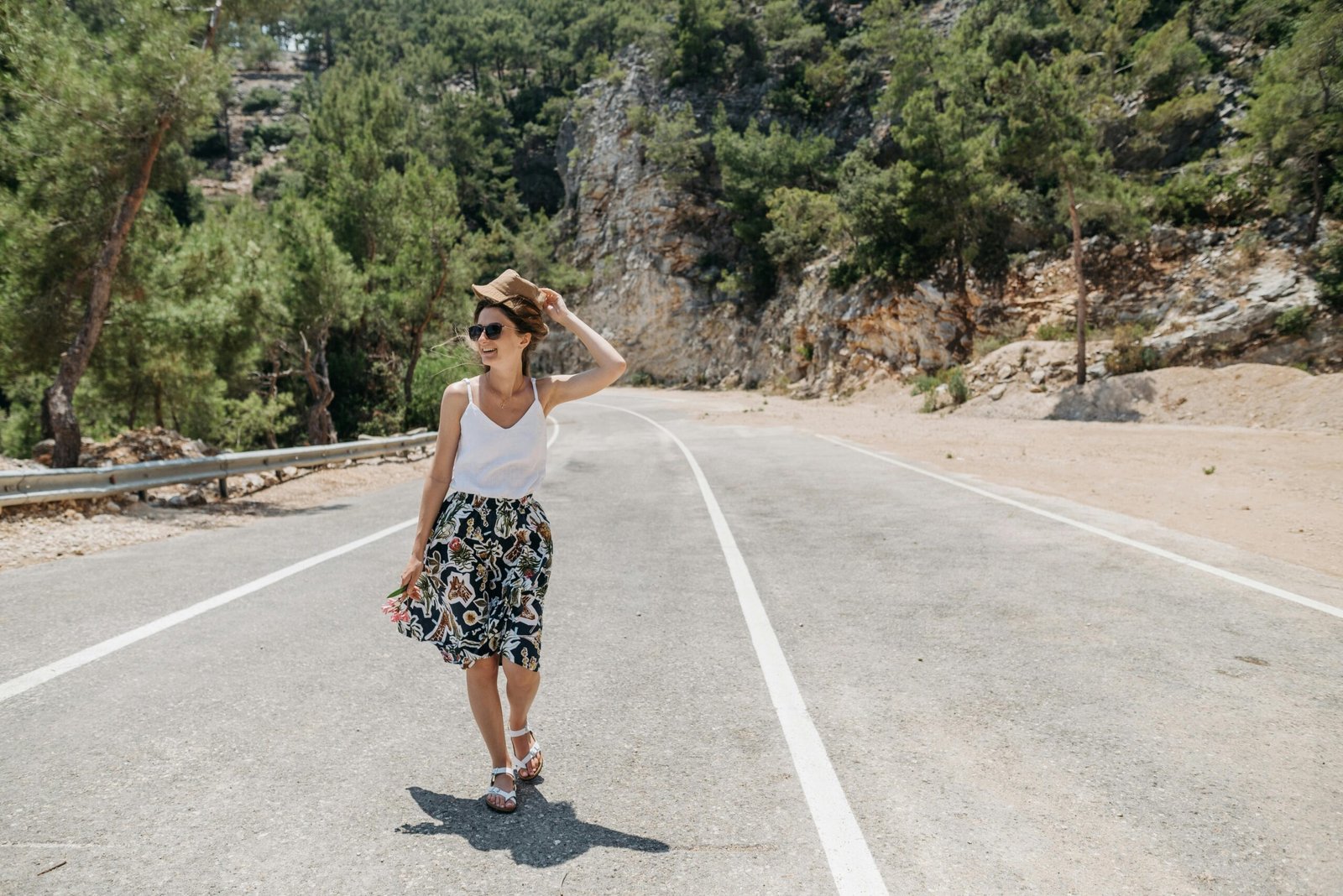 Stylish female traveler confidently exploring a new destination, wearing a functional multi-pocket travel vest for ultimate convenience, security, and hands-free organization.