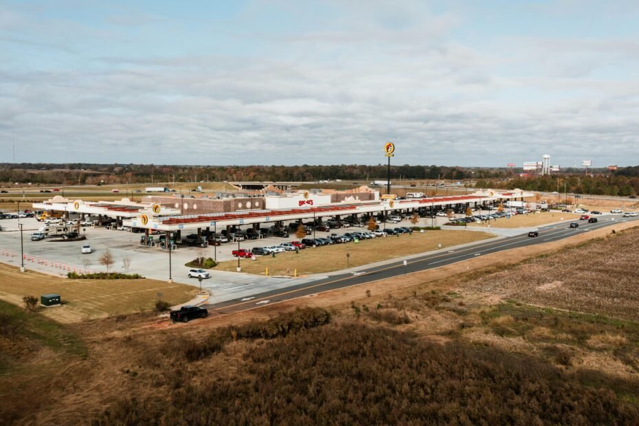 Buc-ee's Georgia travel center opening 2025: Massive highway gas station with clean restrooms, numerous fuel pumps, and famous snacks like Beaver Nuggets and Texas BBQ for road trip travelers.
