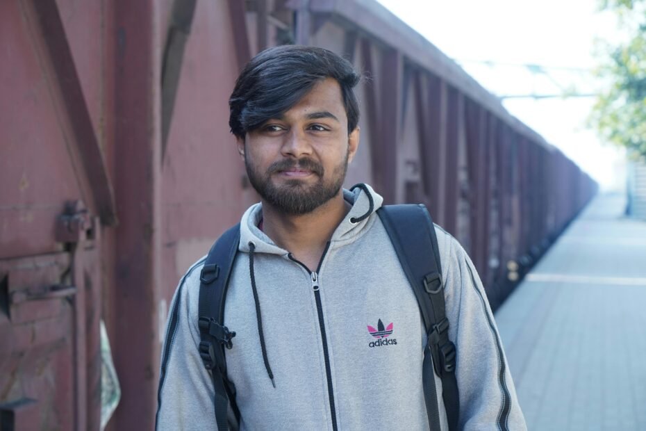 Man with a two-week scruffy beard enjoying his travel vacation, embracing natural facial hair growth and a relaxed grooming routine.