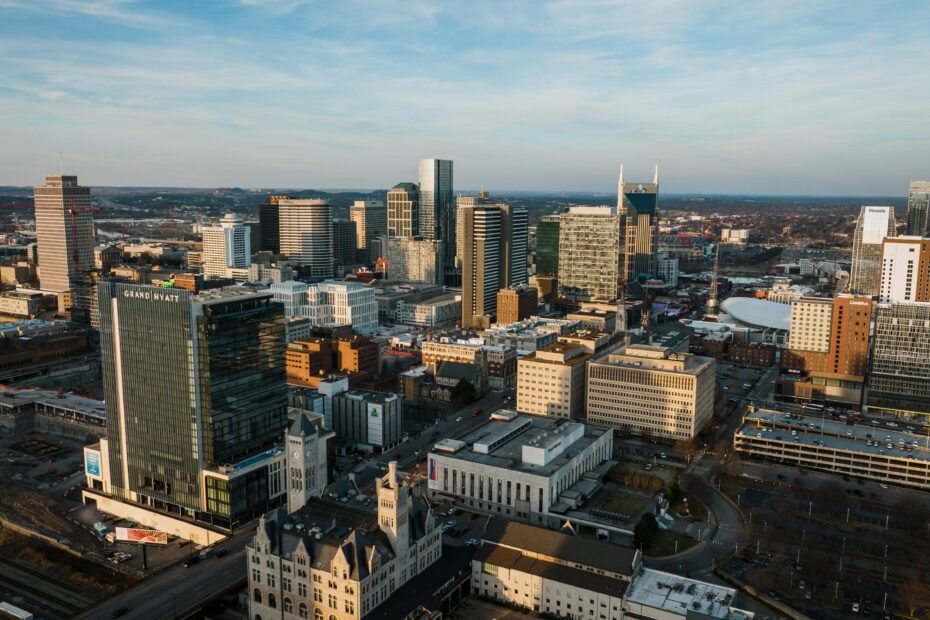 Vibrant Nashville skyline with iconic landmarks and Broadway lights, representing a perfect Music City travel package deal and an unforgettable vacation experience.