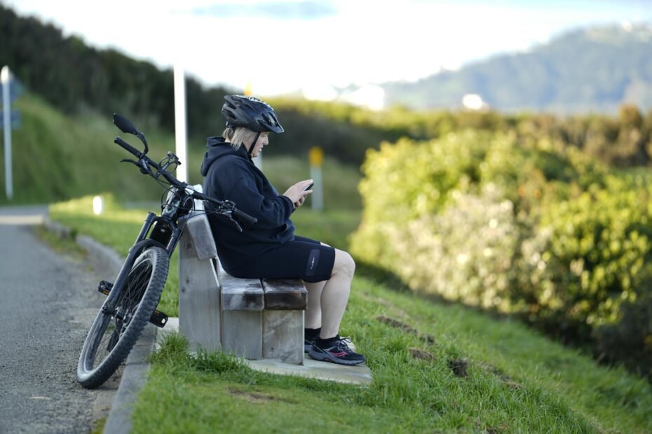 Bicyclists enjoying the scenic Swamp Rabbit Trail in Travelers Rest, SC, showcasing the charming small town's blend of outdoor adventure, local dining, and mountain views.
