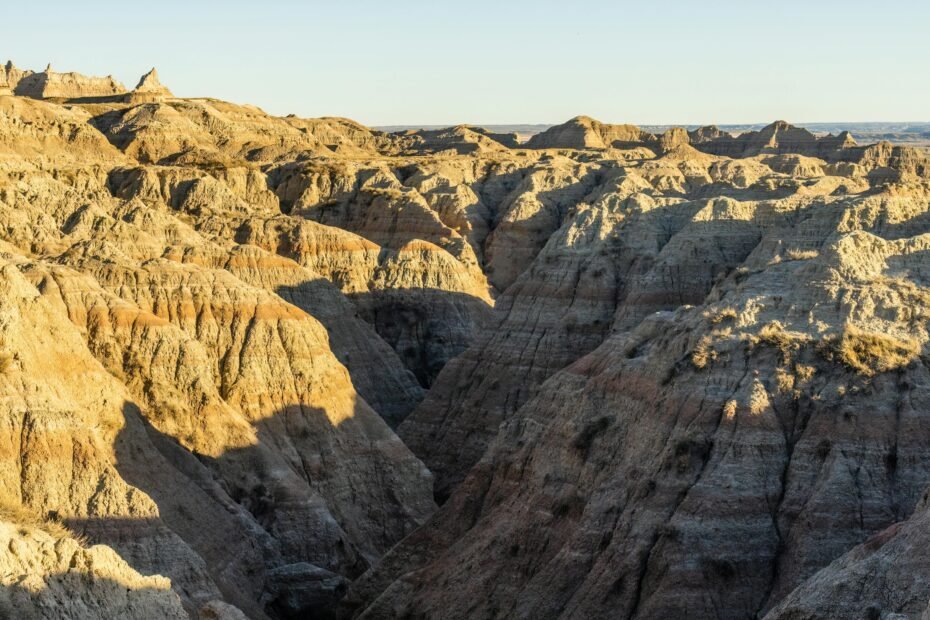 Travel safely in South Dakota: scenic landscape with a road or trail, symbolizing preparedness for road trips, hiking, and wildlife encounters in the Black Hills or Badlands.