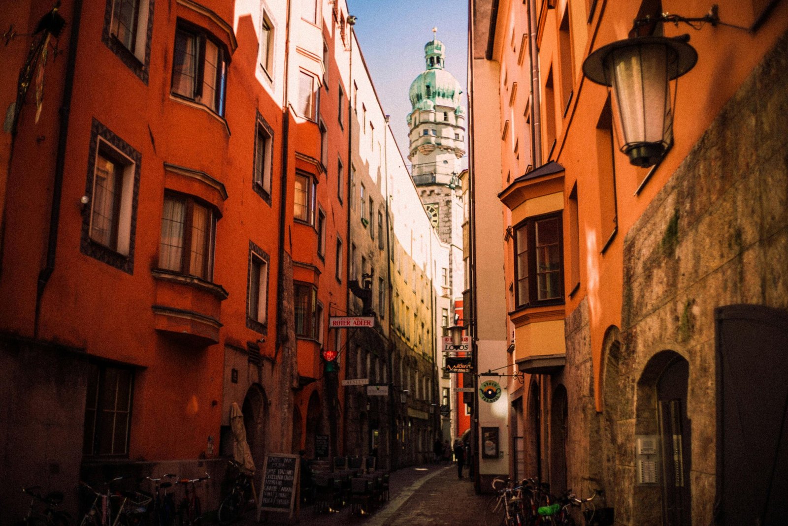 Vibrant historic European city street scene, capturing the charm and affordability of budget travel in destinations like Prague, Budapest, Krakow, or Lisbon, with beautiful architecture and a welcoming atmosphere.