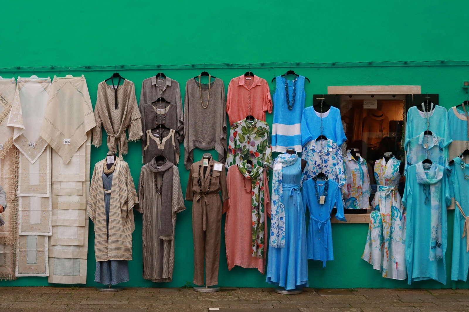 Stylish person packing a versatile travel wardrobe for a European trip, including comfortable mix-and-match clothes for all seasons and activities.