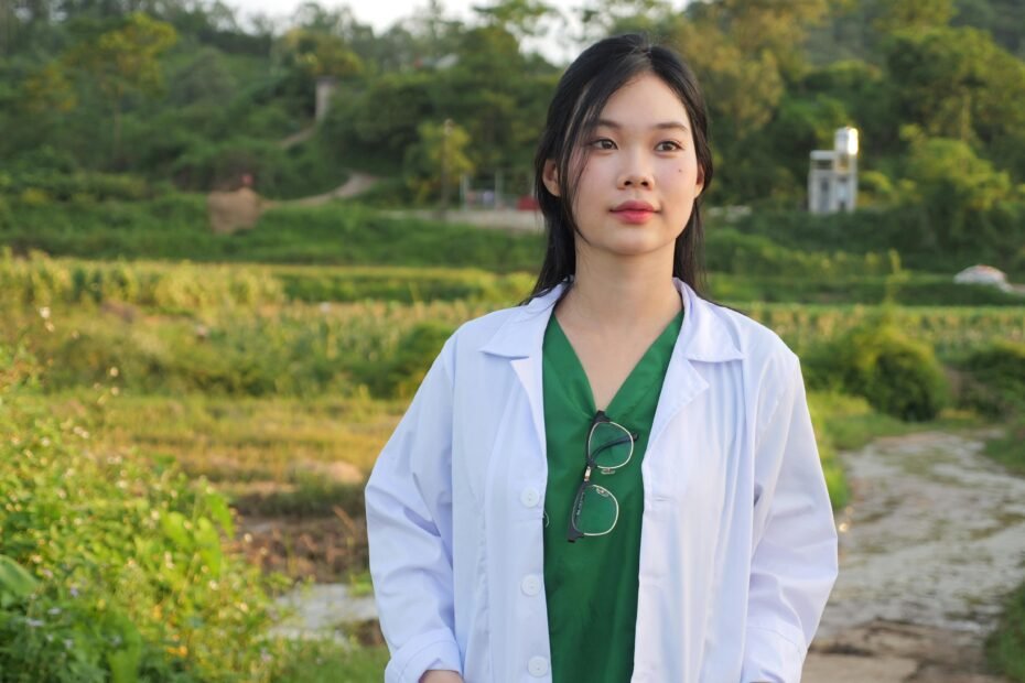 Professional travel nurse charting her career path on a world map, representing the journey, education, and timeline required to become a global healthcare worker.