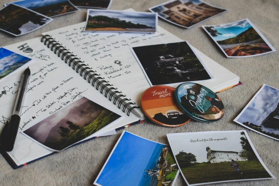 Traveler creating a vibrant travel recap, organizing photos, souvenirs, and journal entries to preserve cherished memories and share their unique journey experiences.