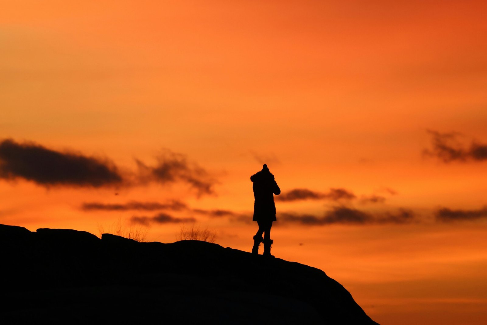 Traveler enjoying a beautiful, uncrowded destination, symbolizing cheap places to travel in February and an affordable winter escape during shoulder season.