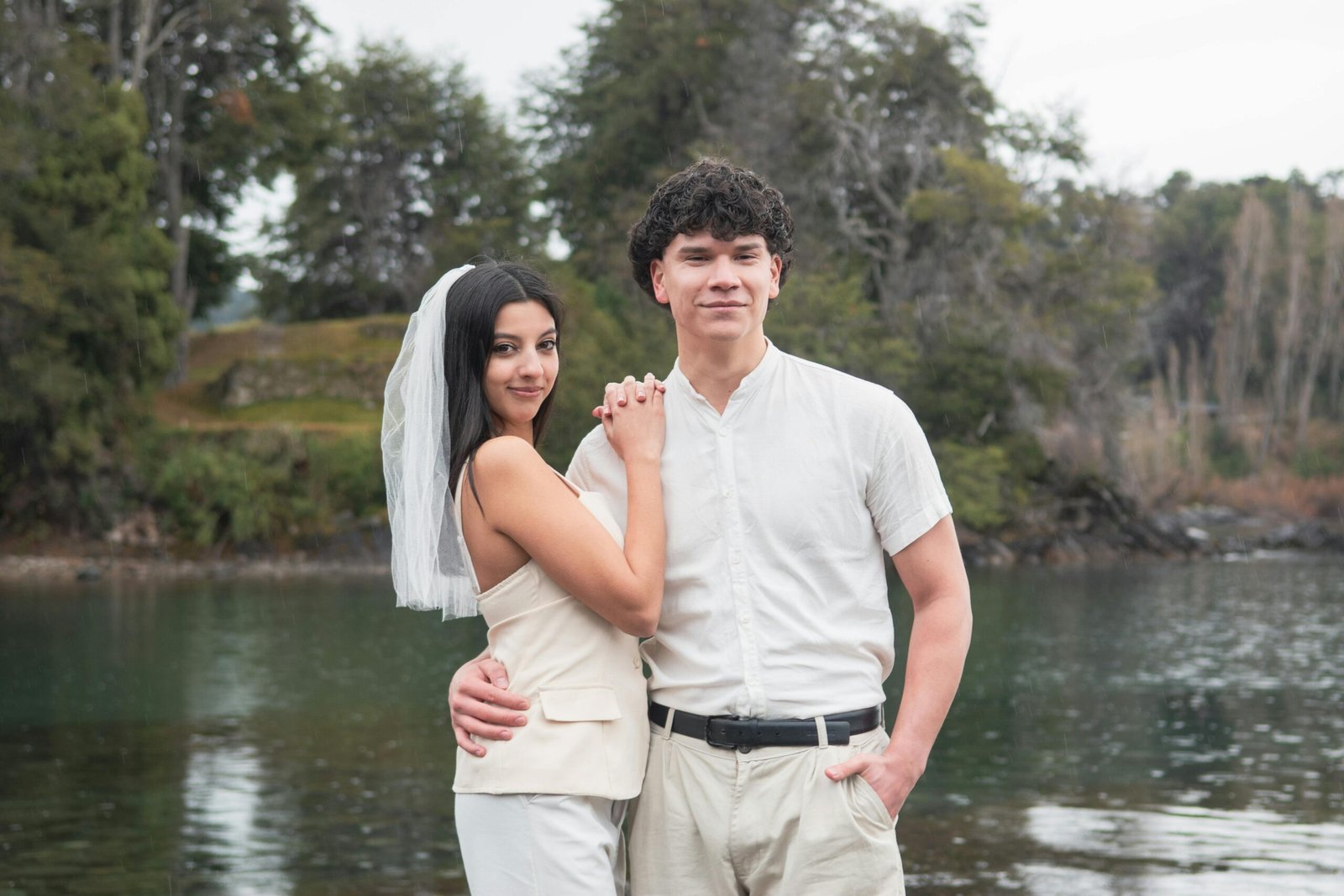 A romantic couple enjoying their intimate destination wedding in a stunning scenic location, perfectly illustrating the unique joy of a travel wedding.