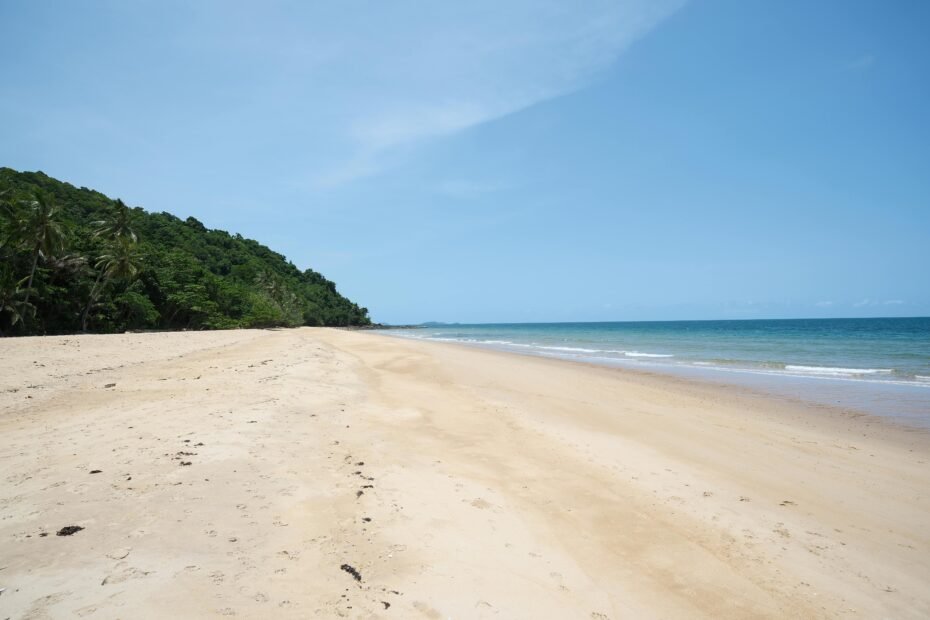 Pristine white sand beach with dazzling turquoise water in Turks and Caicos, illustrating the ideal Caribbean vacation destination and the best time to visit.