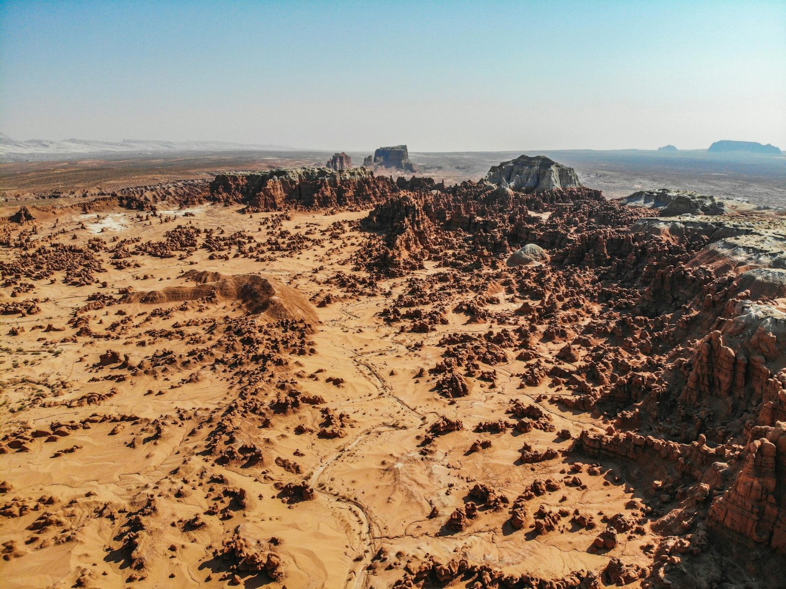A radiologic technologist, in medical attire, stands confidently with a suitcase or backpack, looking towards a scenic new city or landmark, symbolizing the exciting career path of travel radiography jobs and professional adventure.
