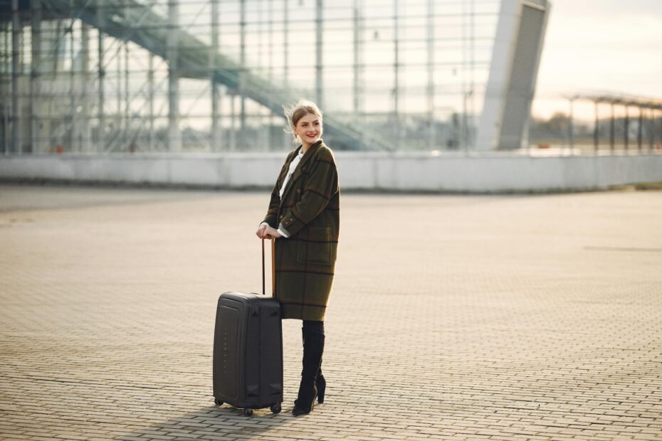 Woman confidently applying TSA-compliant travel hairspray at the airport, maintaining her perfect hairstyle for a polished look while traveling.