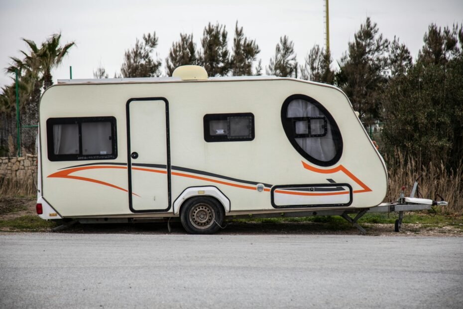 Travel trailer being safely towed on a highway, highlighting the importance of understanding and managing RV weight for secure journeys.