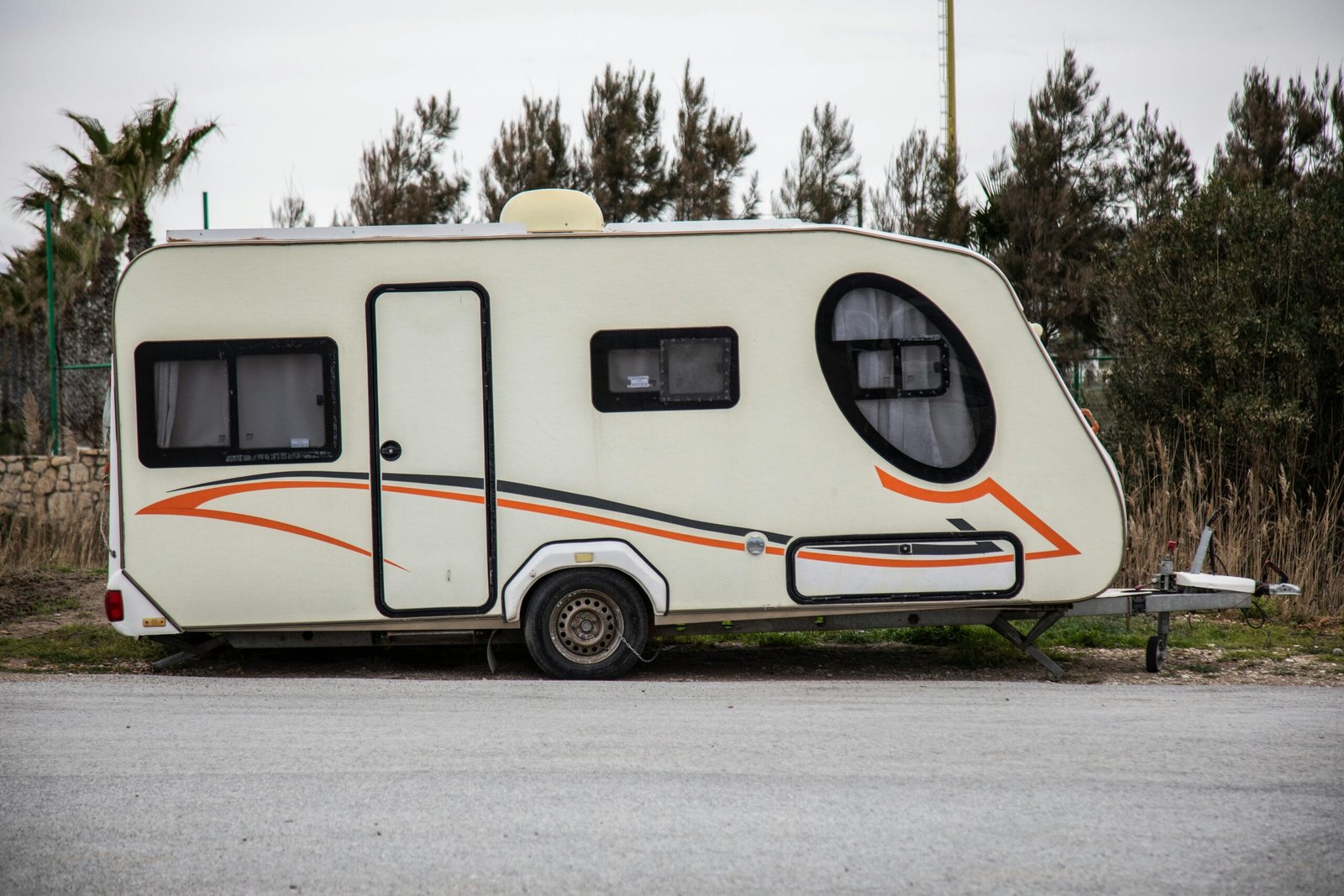 Travel trailer being safely towed on a highway, highlighting the importance of understanding and managing RV weight for secure journeys.