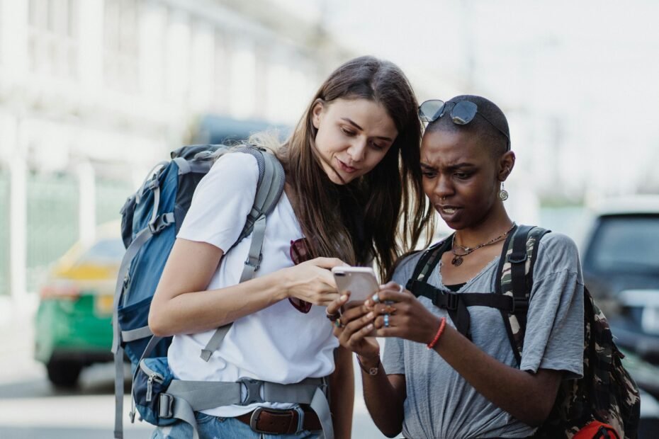 Traveler using a smartphone with various travel planning and navigation apps to explore a new city, representing efficient and stress-free global travel in 2025.