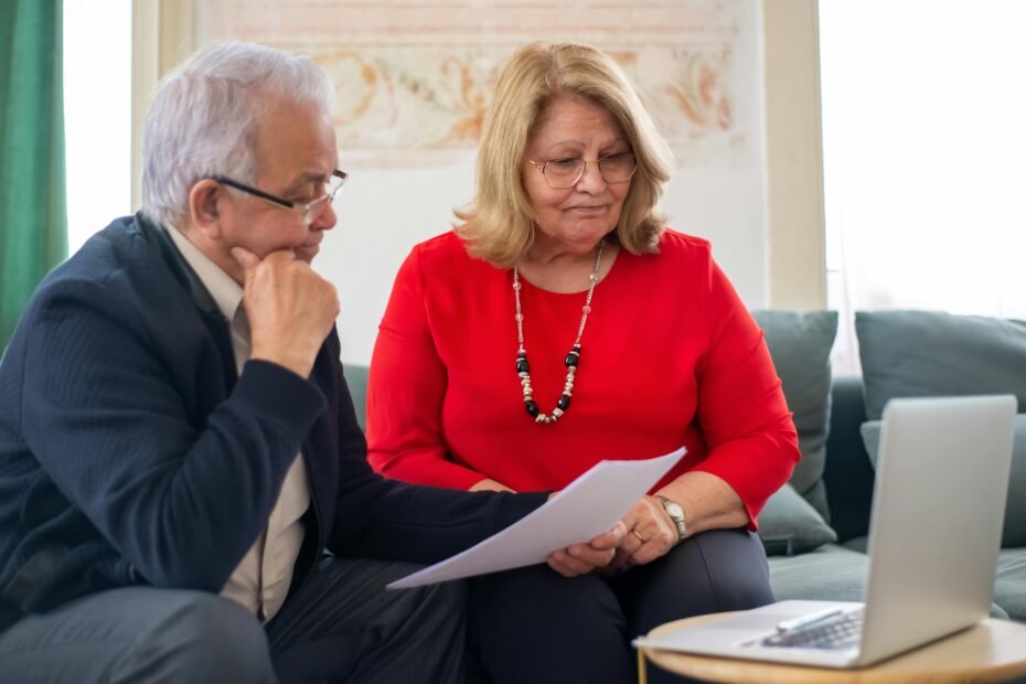 Traveler researching Berkshire Hathaway Travel Protection reviews and coverage on a laptop for confident trip planning.