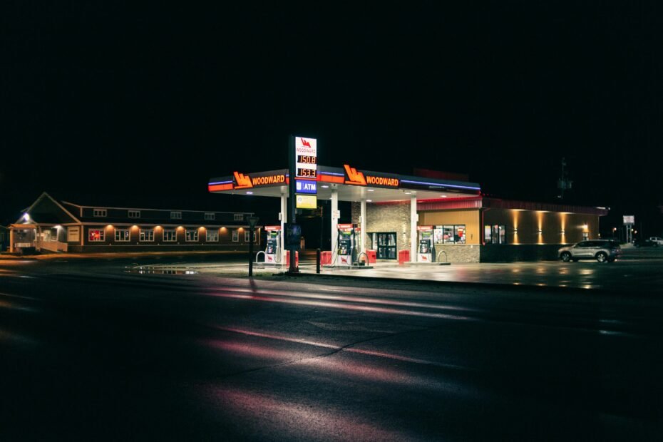 Exterior view of a modern Cubbies Travel Center at night, featuring bright lighting, multiple fuel pumps, and an inviting main entrance, representing a clean and convenient highway rest stop.