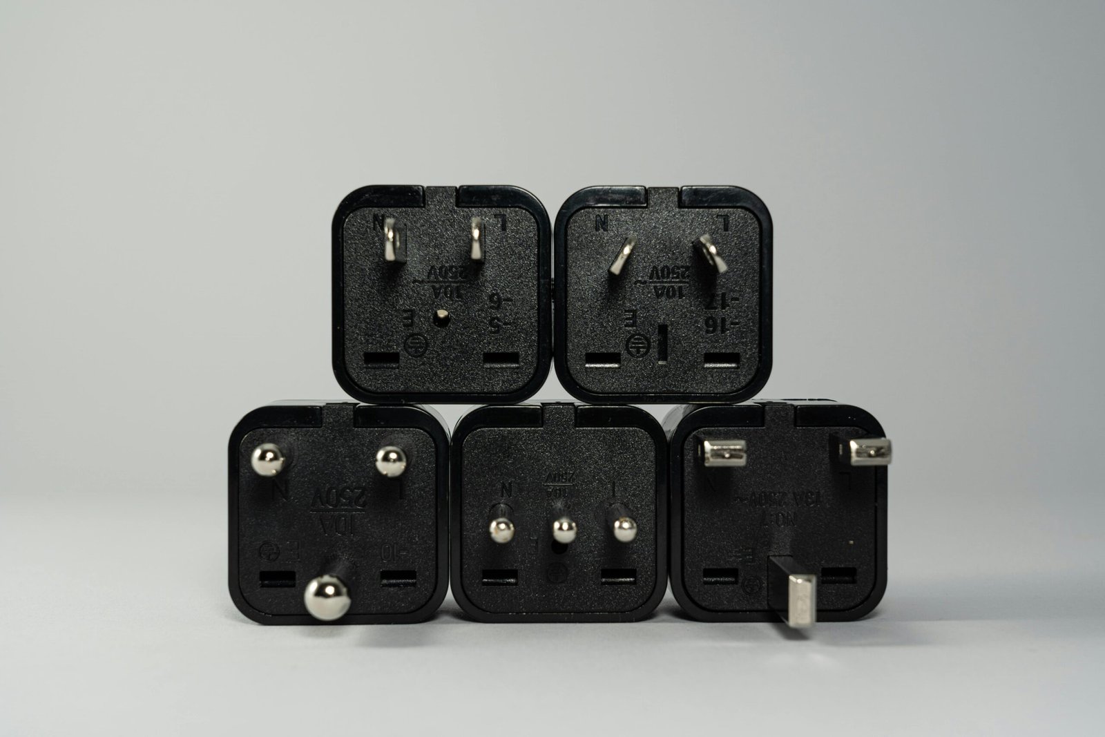 Universal travel adapter powering a smartphone and tablet, illustrating essential gear for international travel and keeping devices charged, highlighting quick solutions for finding an adapter in local electronics stores or airports.