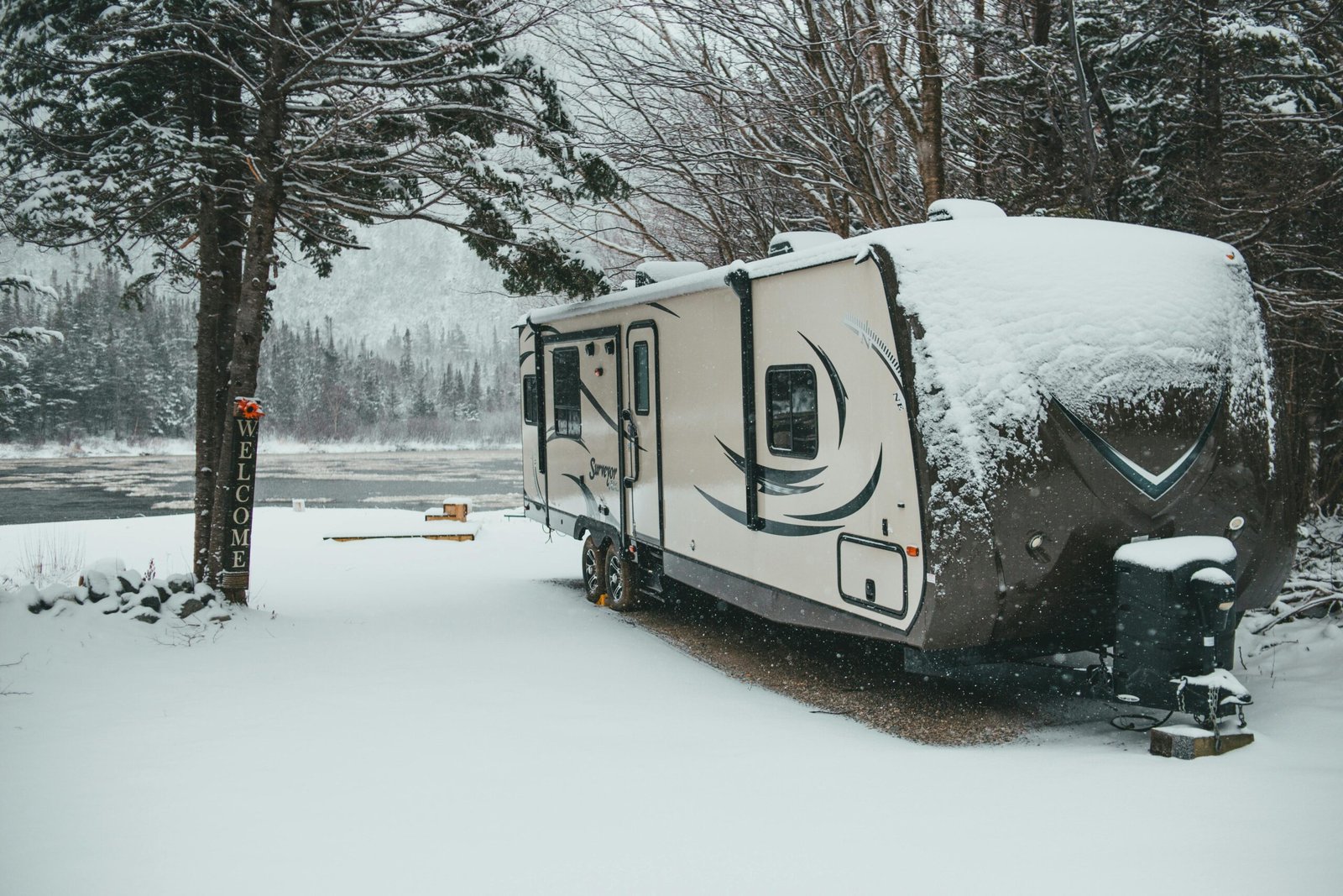 Rockwood travel trailer (RV) parked in a picturesque natural setting, symbolizing quality construction and adventurous camping for future travels.