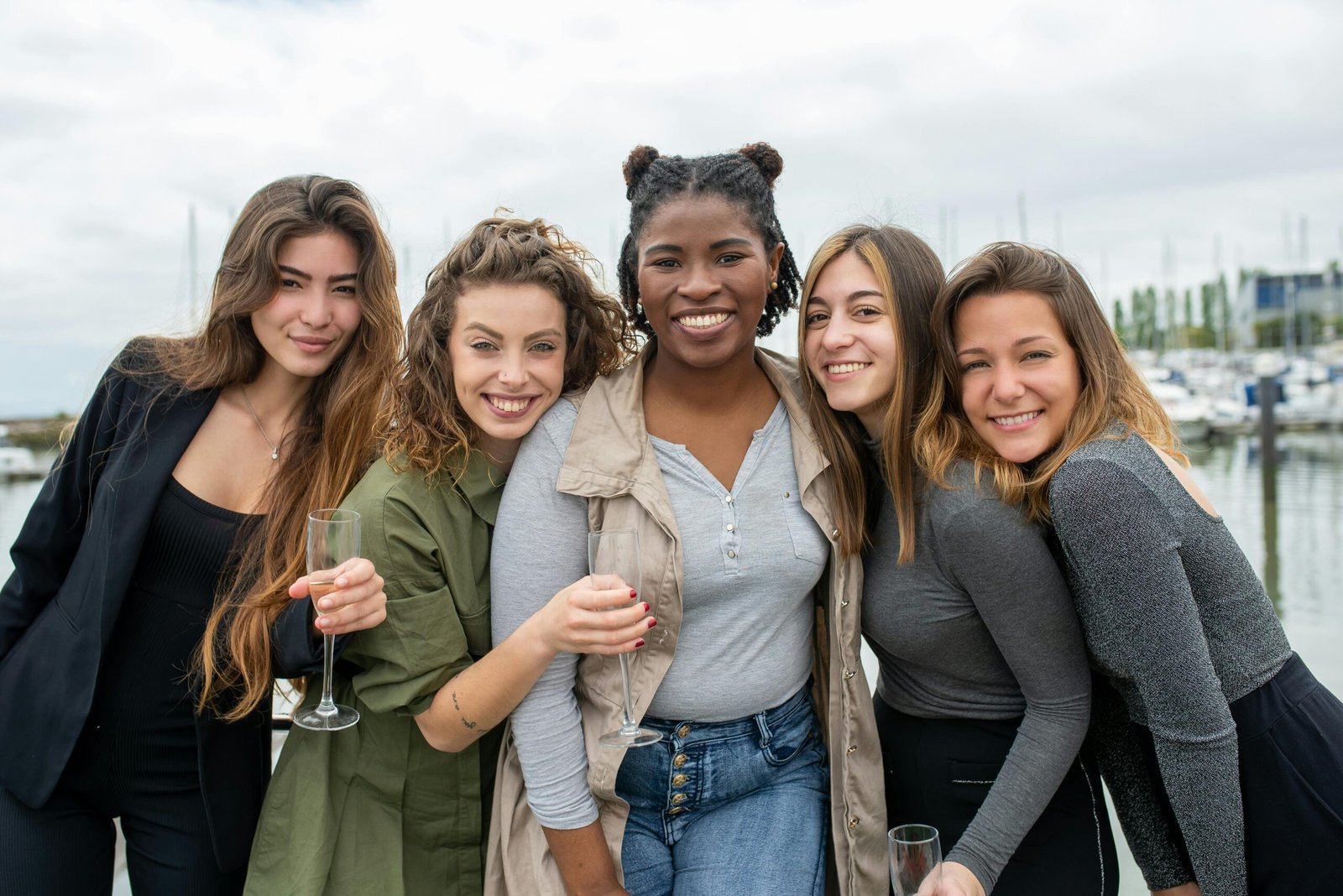 Diverse travelers smiling and enjoying an unforgettable, personalized dream vacation in a stunning global destination, embodying the seamless experiences offered by Kim Travel.